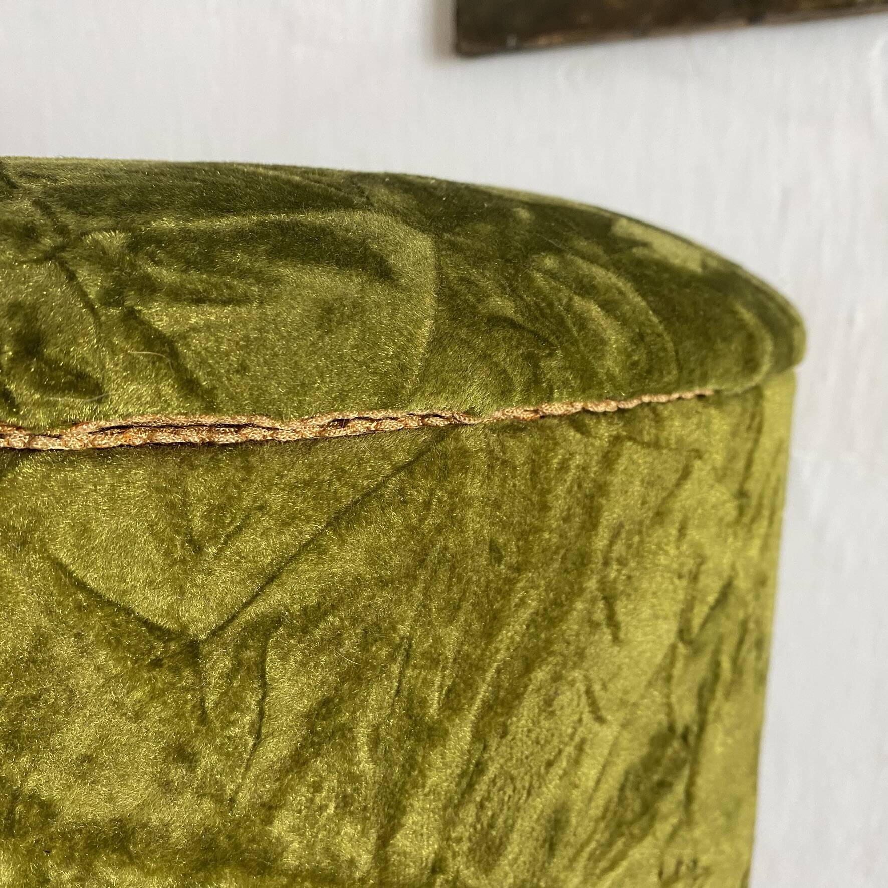 Green velvet storage pouffe from the 1960s.