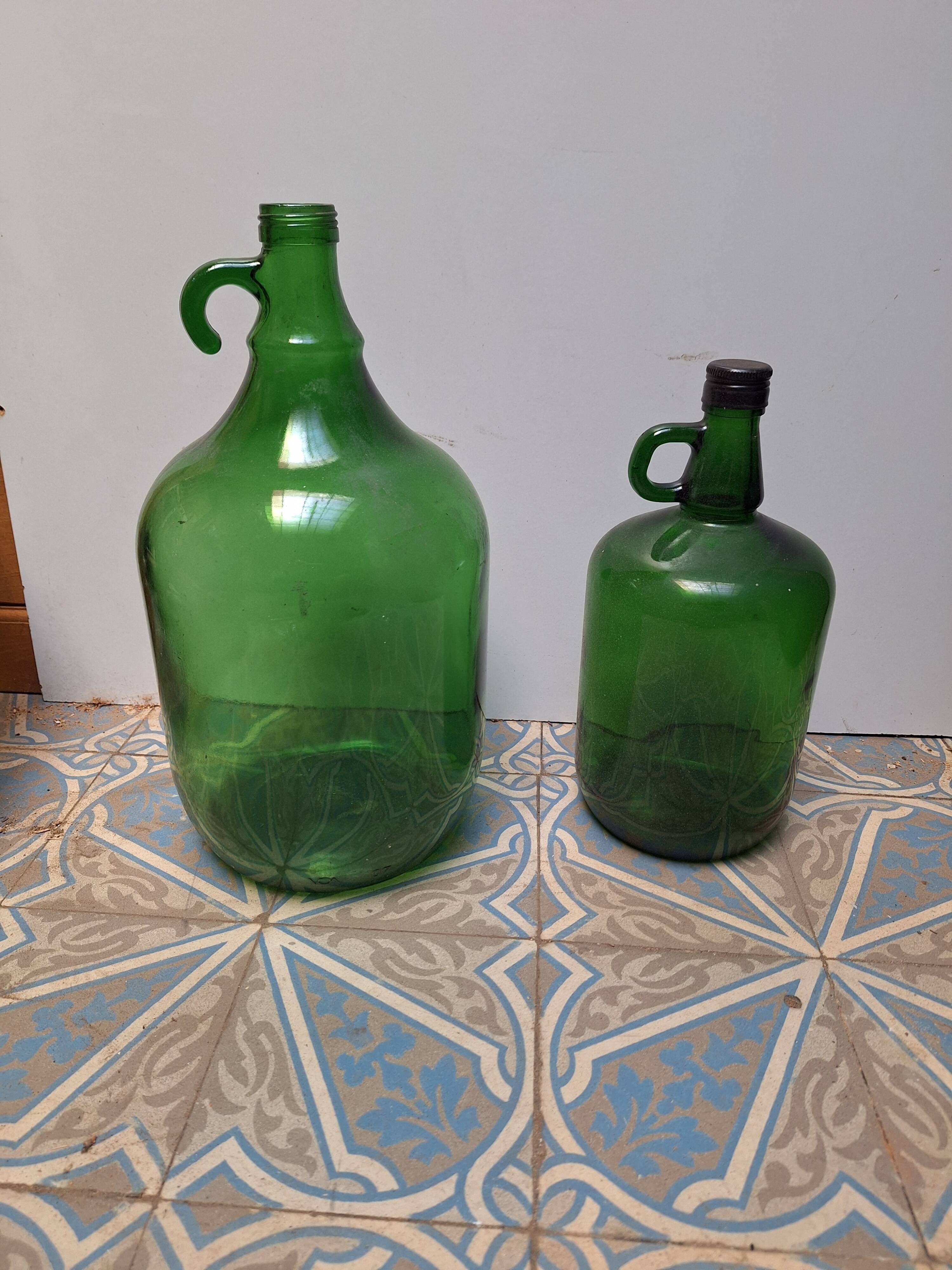 Set of 2 vintage green glass Demijohns.