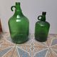 Set of 2 vintage green glass Demijohns.