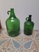 Set of 2 vintage green glass Demijohns.