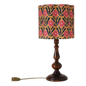 Table lamp, turned wooden base and printed flower-shaped lampshade