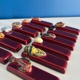 Set of vintage red ceramic knife holders, marine motif, retro style