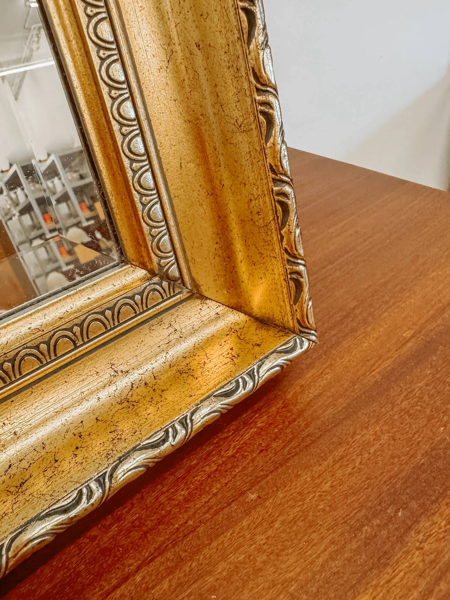 XL vintage bevelled mirror with a gold frame.