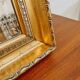 XL vintage bevelled mirror with a gold frame.