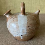 Small sandstone goat in the style of marsh sandstone or hot air balloon