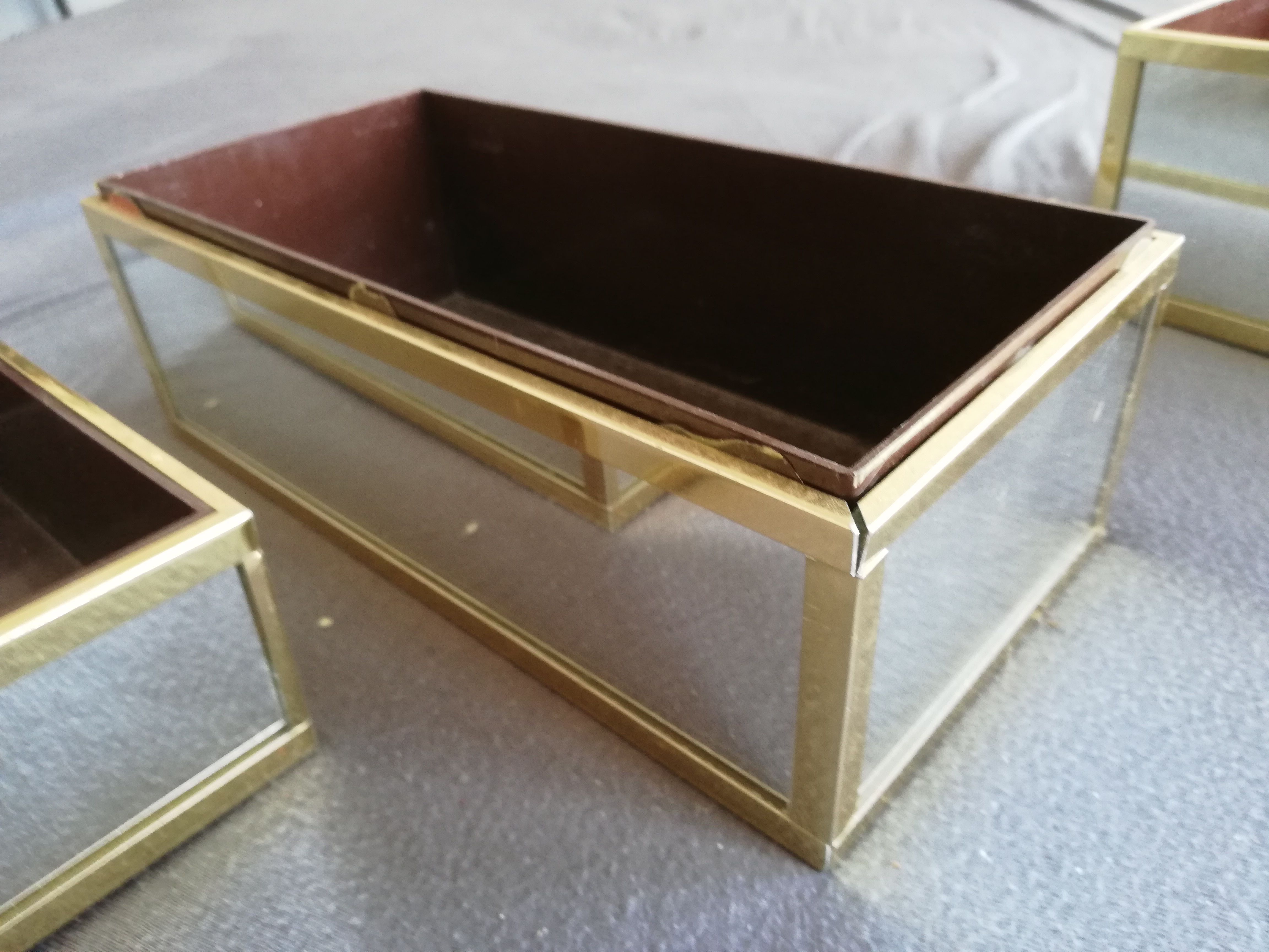 Golden metal table gardeners and Ousta design mirrors made in Holland
