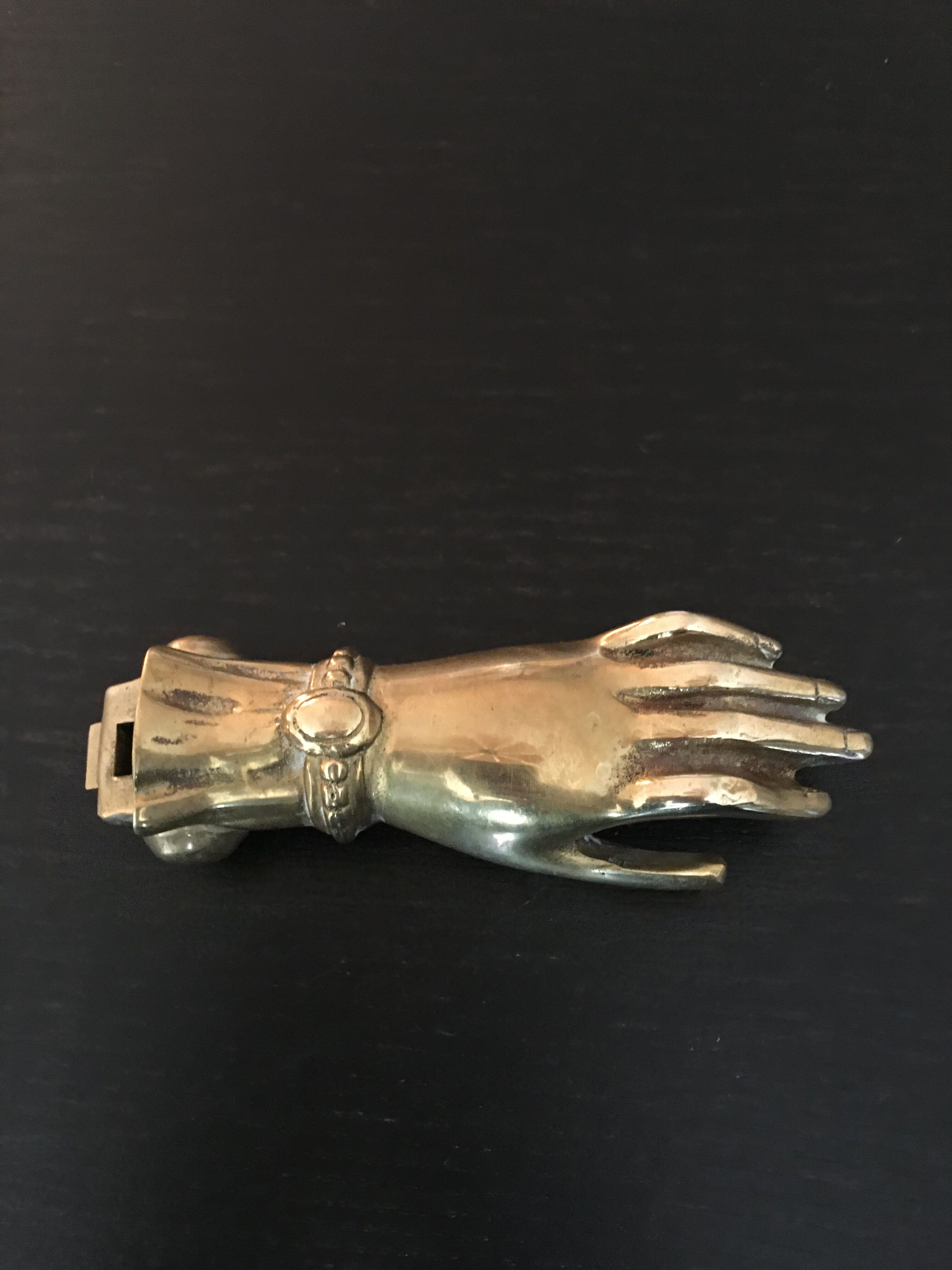Hand brass paperweight