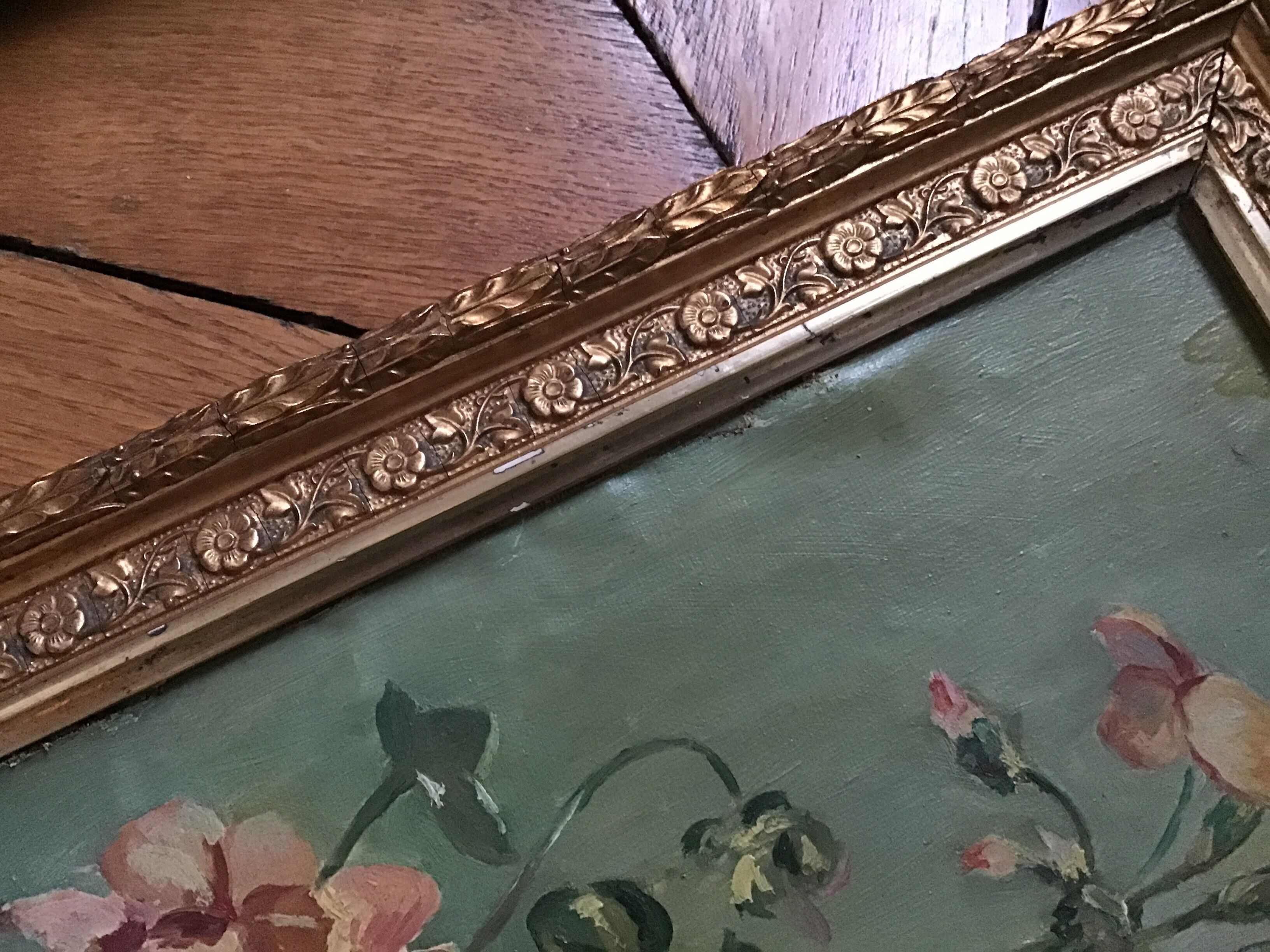 Two old paintings of flowers and gilded frames