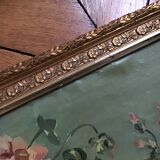 Two old paintings of flowers and gilded frames