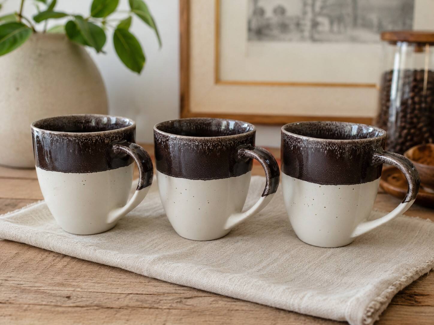 Set of three two-tone mugs, glazed stoneware, café workshop style.