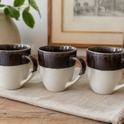 Set of three two-tone mugs, glazed stoneware, café workshop style.
