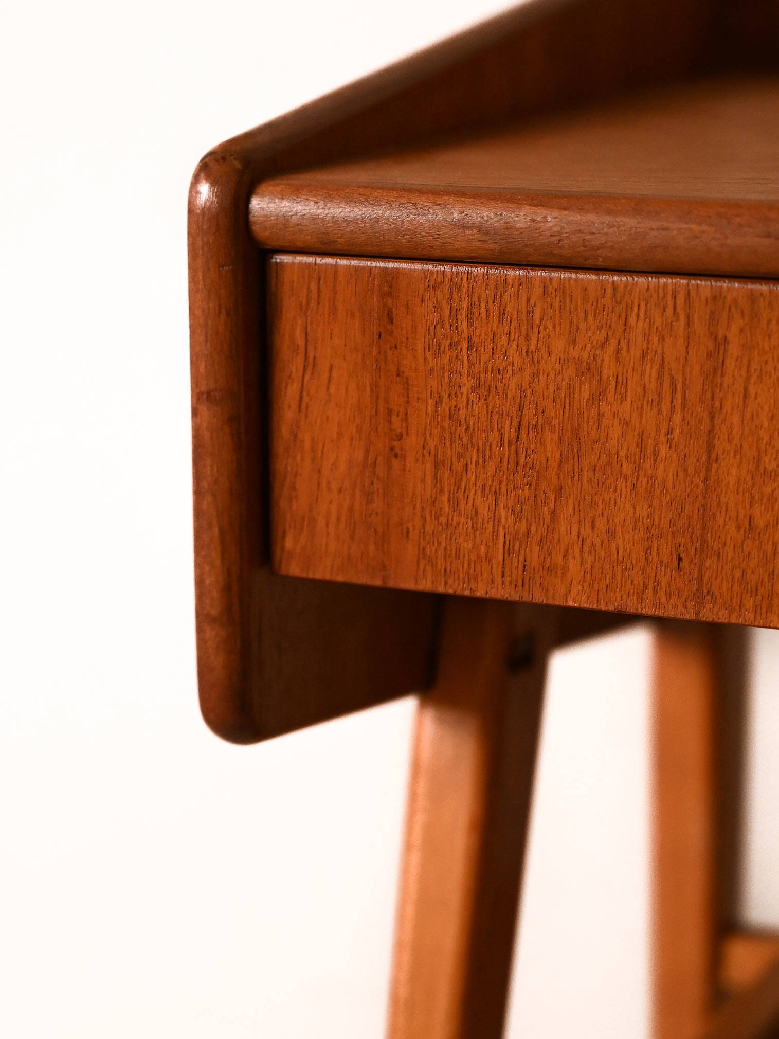 Bedside table with rattan magazine rack