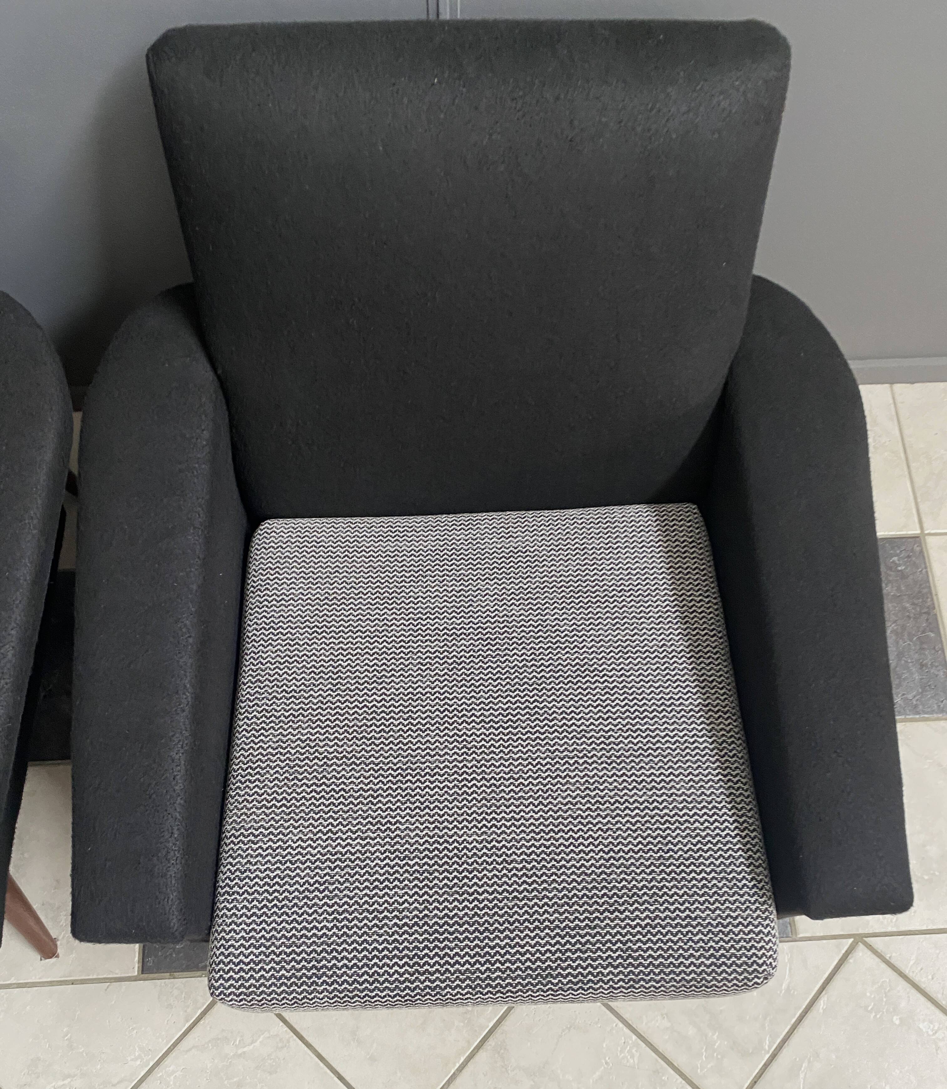 set of two black and white arm chairs 1960s