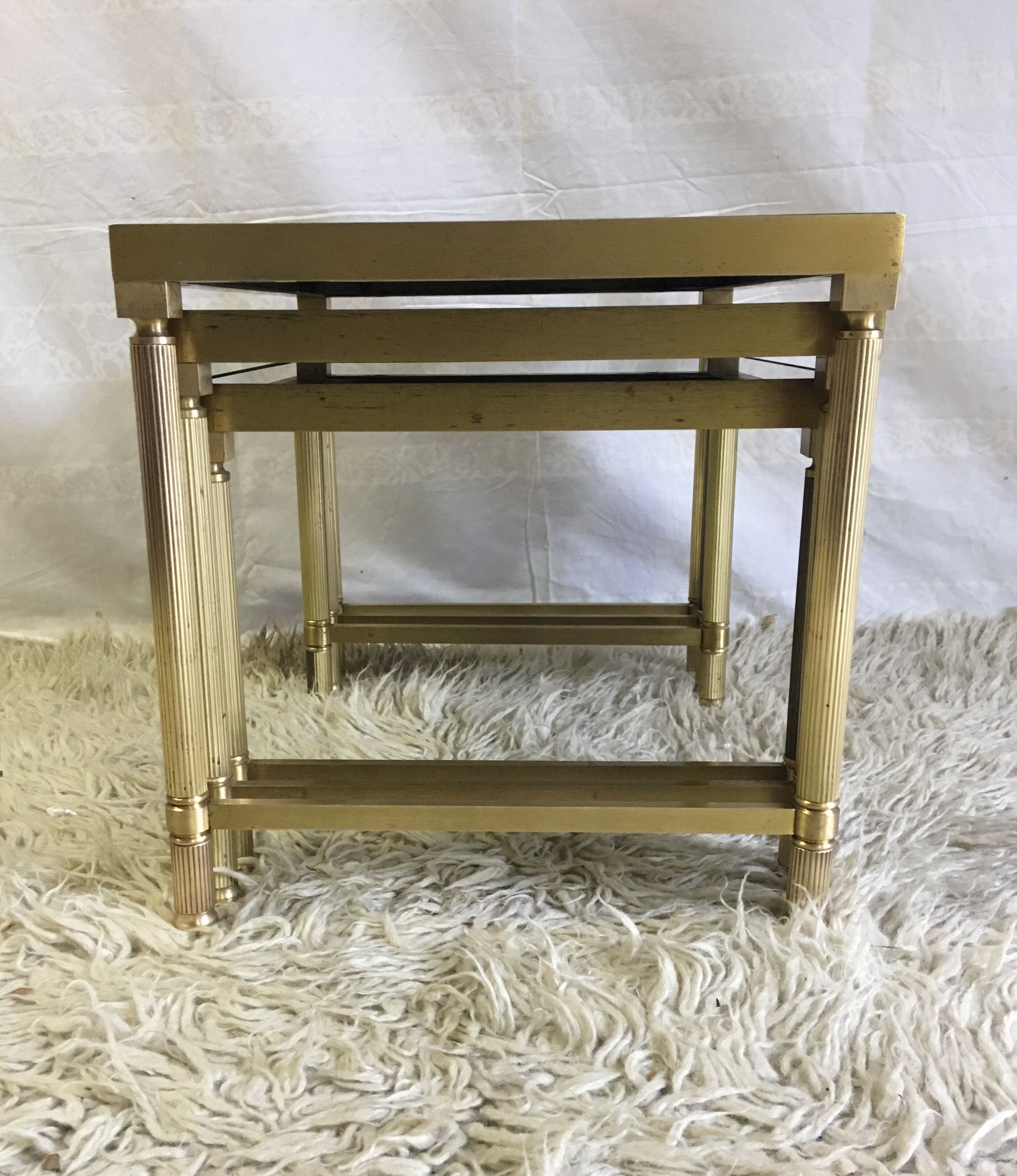 Brass and glass pull out tables 70