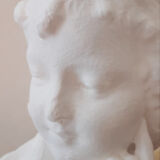 Plaster bust reading child