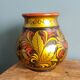 Khokhloma vase, Russian lacquered wood craftsmanship, hand-painted floral decoration.