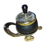 Original vintage ashtray on a small wheeled stand.