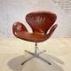 First edition Arne Jacobsen Swan chair, original patinated leather, 1950s