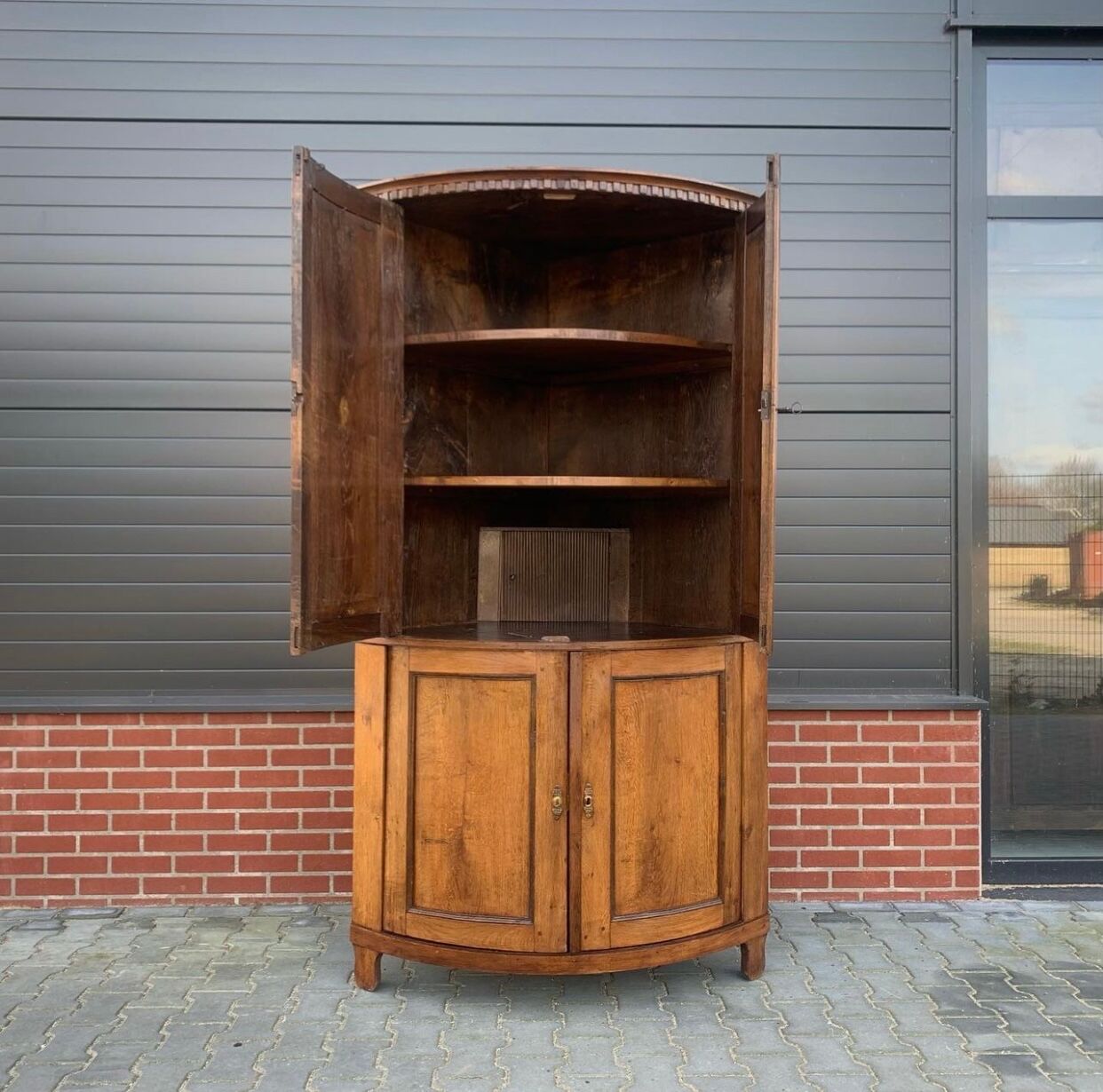 Louis Seize Oak corner cabinet with a quarter curved front