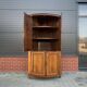 Louis Seize Oak corner cabinet with a quarter curved front