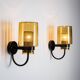Pair of black metal wall lamps with yellow shades and inner diffuser