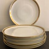 7 flat plates in porcelain of Limoges Bernardaud, decoration of golden Greek, XXth century