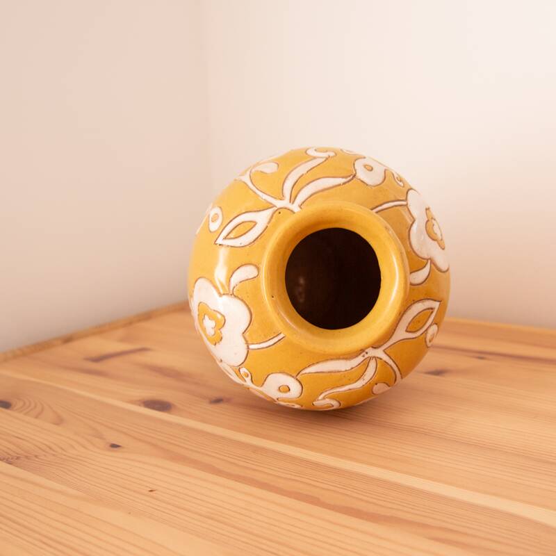 Yellow enamel vase with white flower decoration