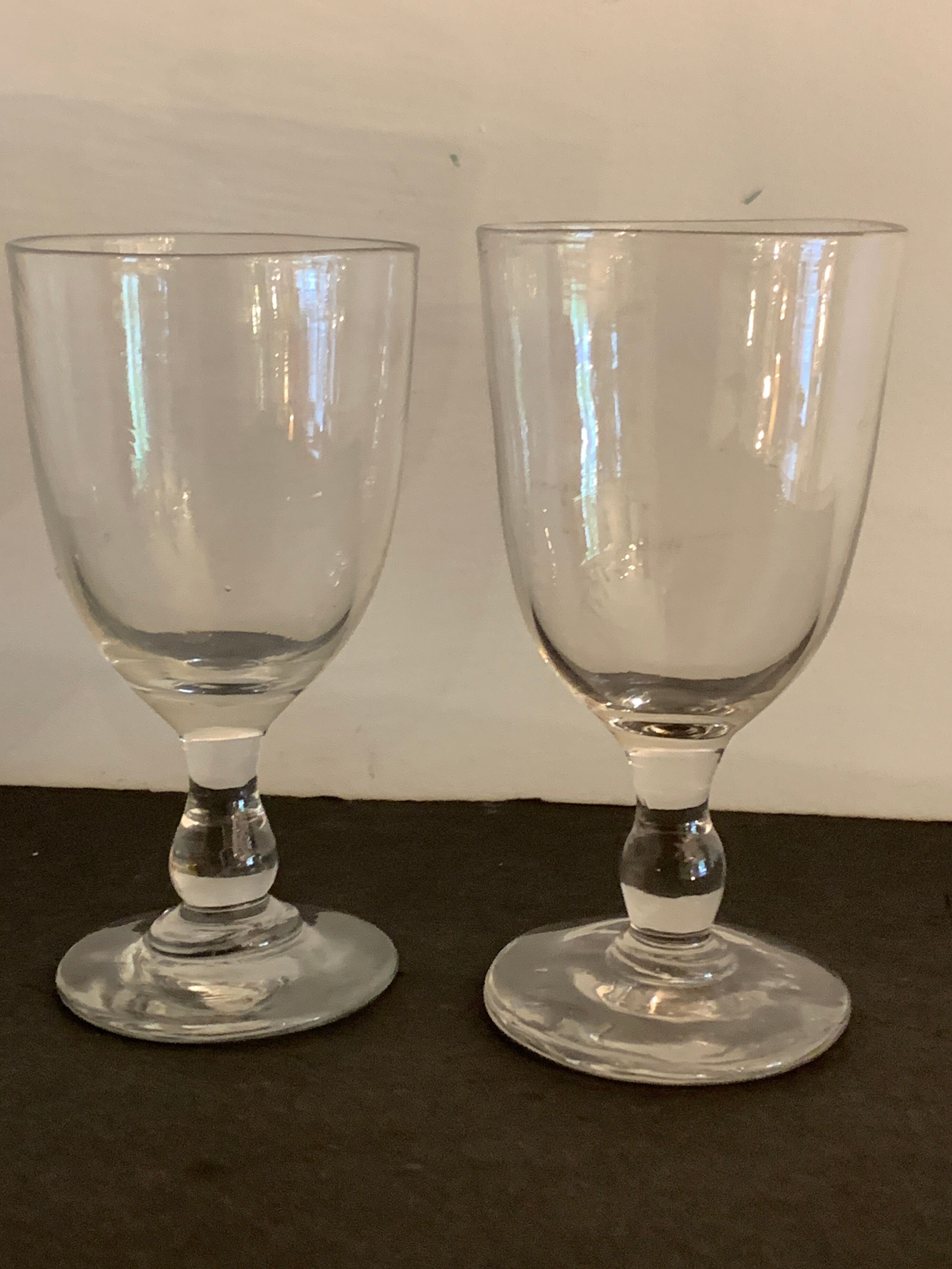 7 antique blown foot glasses