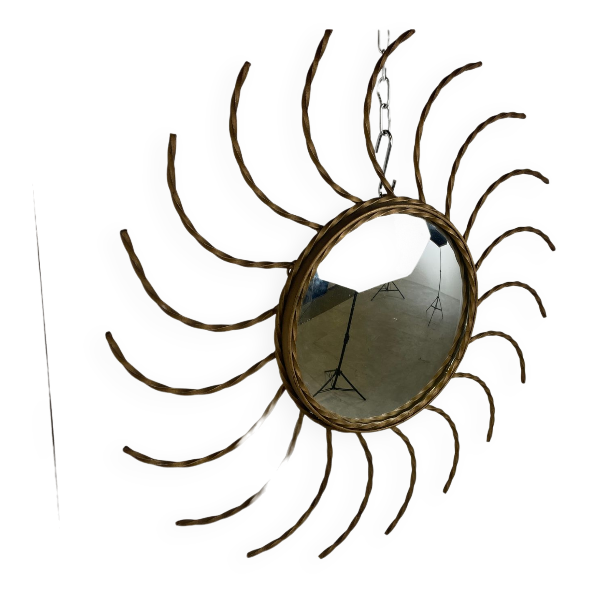 Mid century gold sunburst mirror with convex glass.