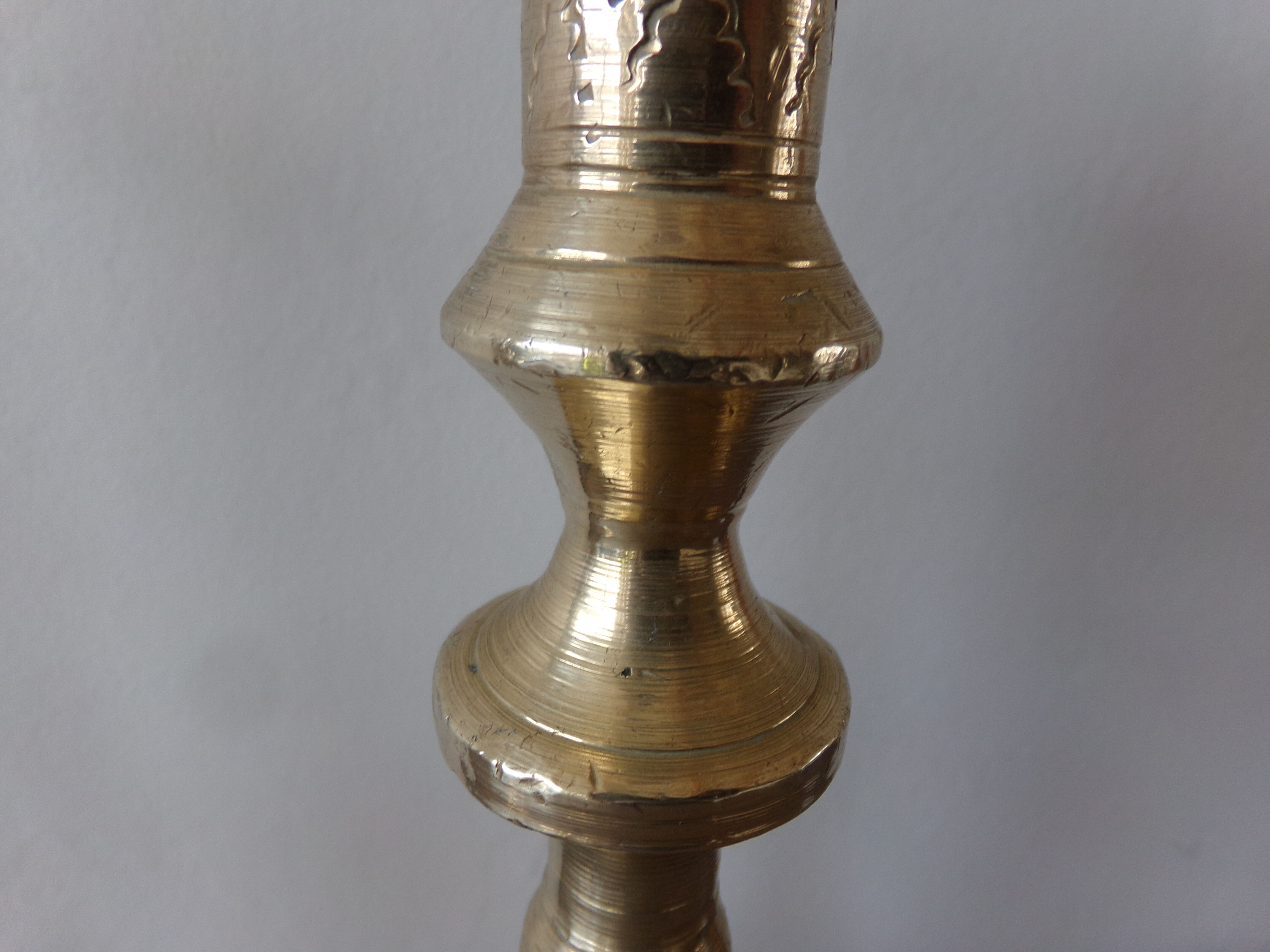 Old candle holder in gilded bronze