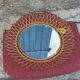 Vintage 1950s sun mirror in gold metal.