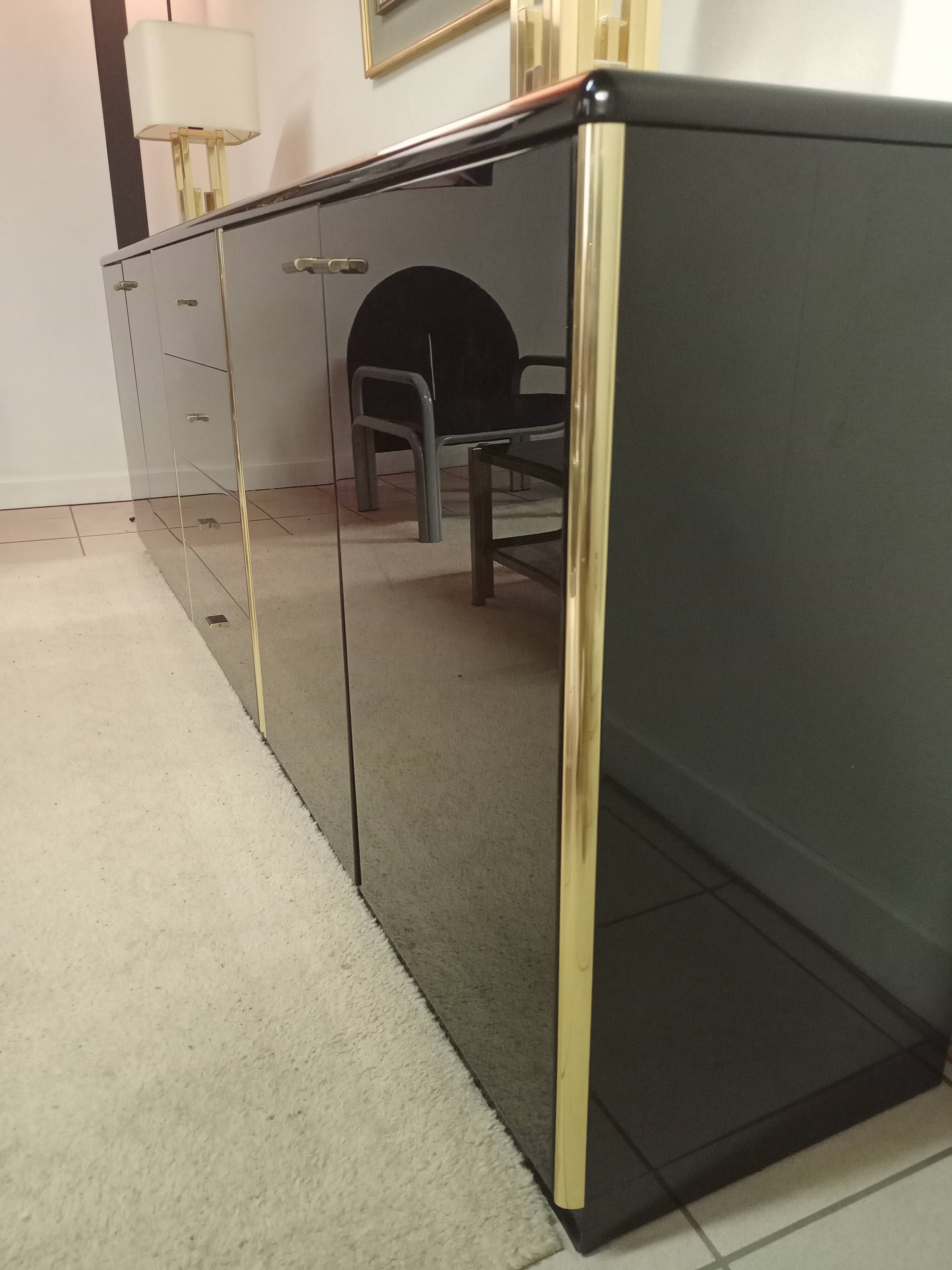 Black lacquered and brass design 70/80