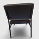 Modernist armchair in black faux leather and metal – 1960s