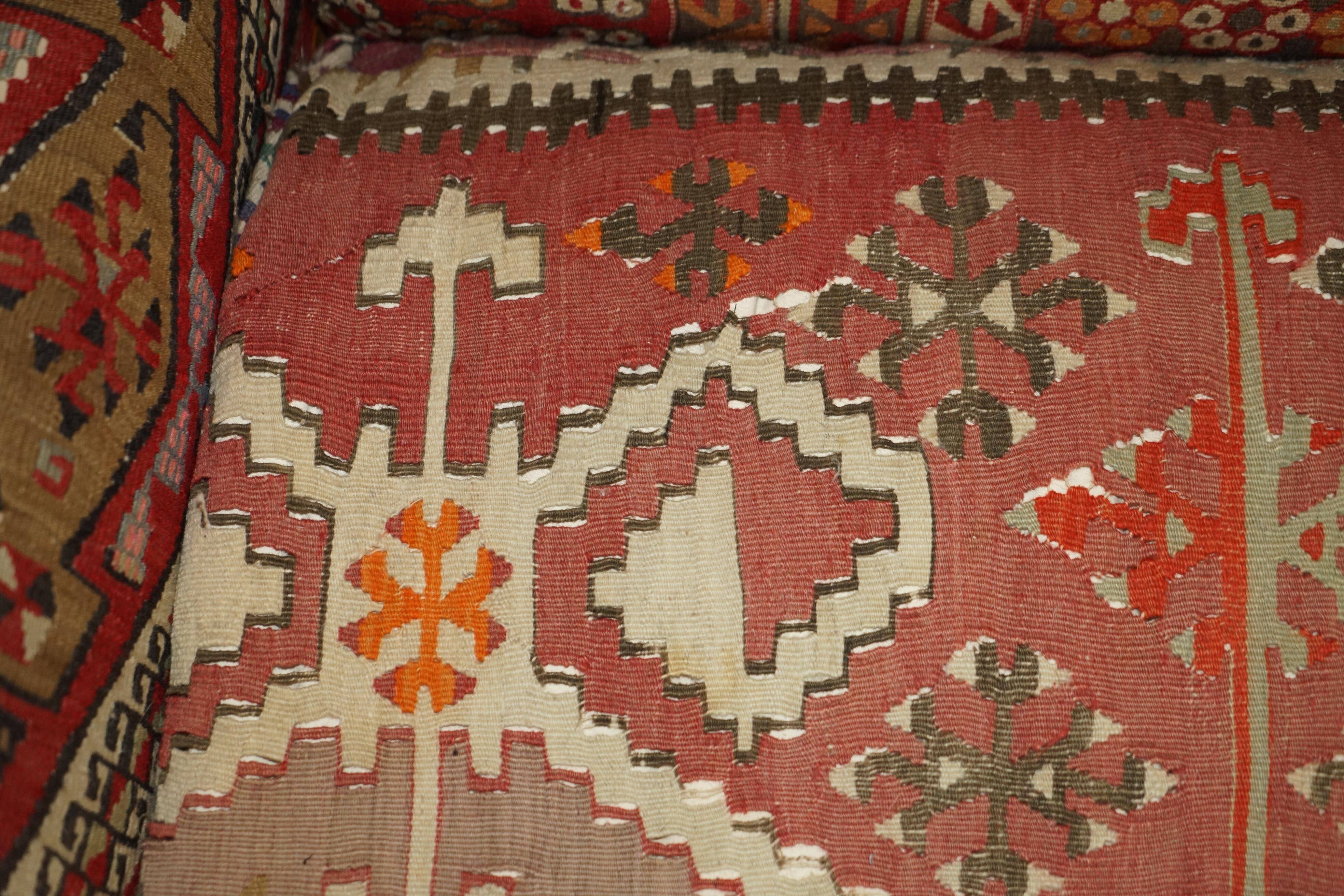 Vintage three-seater canapé by George Smith upholstered in Kilim with feather cushions.
