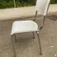 Space age chair with chrome metal and white schoolboy shell, desk 1970.