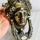 Large antique style brass metal knocker.