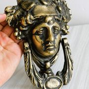 Large antique style brass metal knocker.