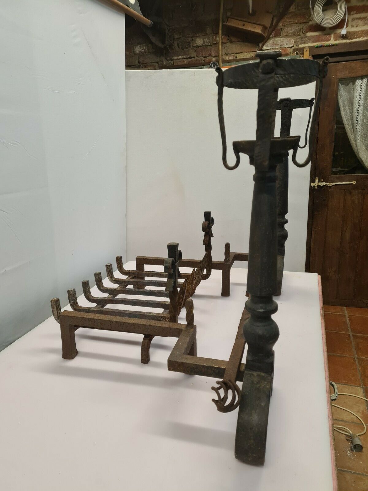 Pair of cast iron andirons for the fireplace