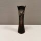 Crystal glass vase, in burgundy/reddish coloured glass with translucent details.