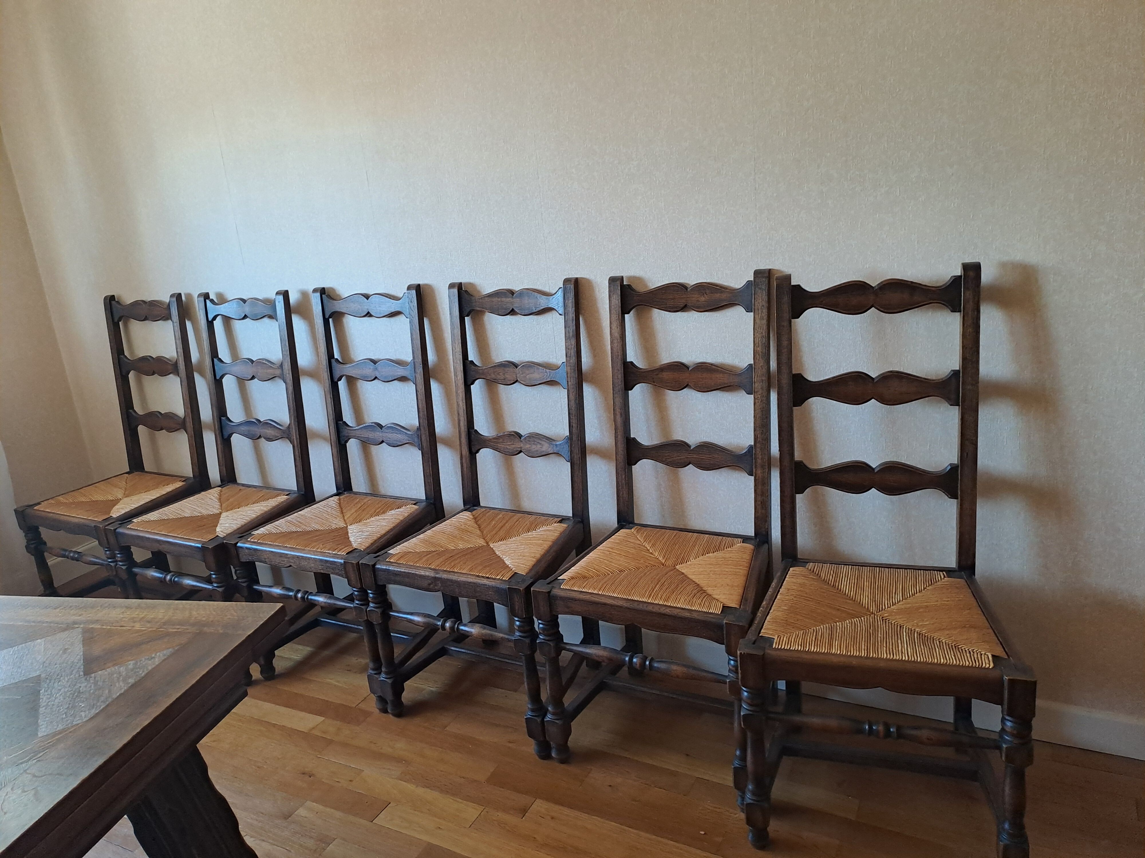 6 wooden and straw chairs