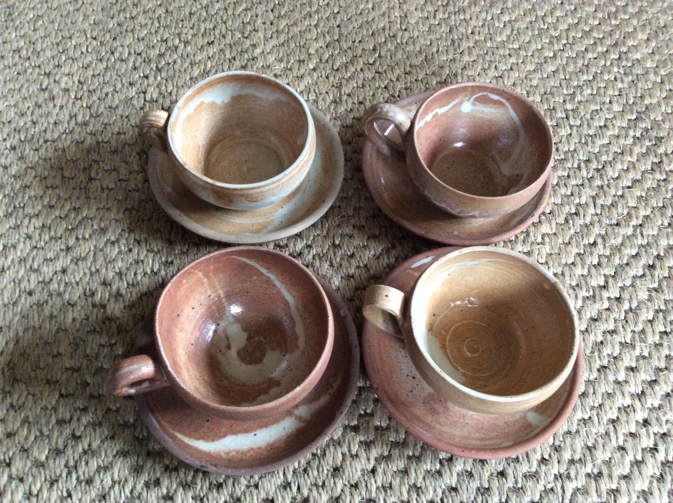 Series of 4 stoneware coffee cups