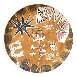 Plat en céramique signé