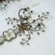 Paire de appliques en cristal et bronze Maison Bagues, années 1960.