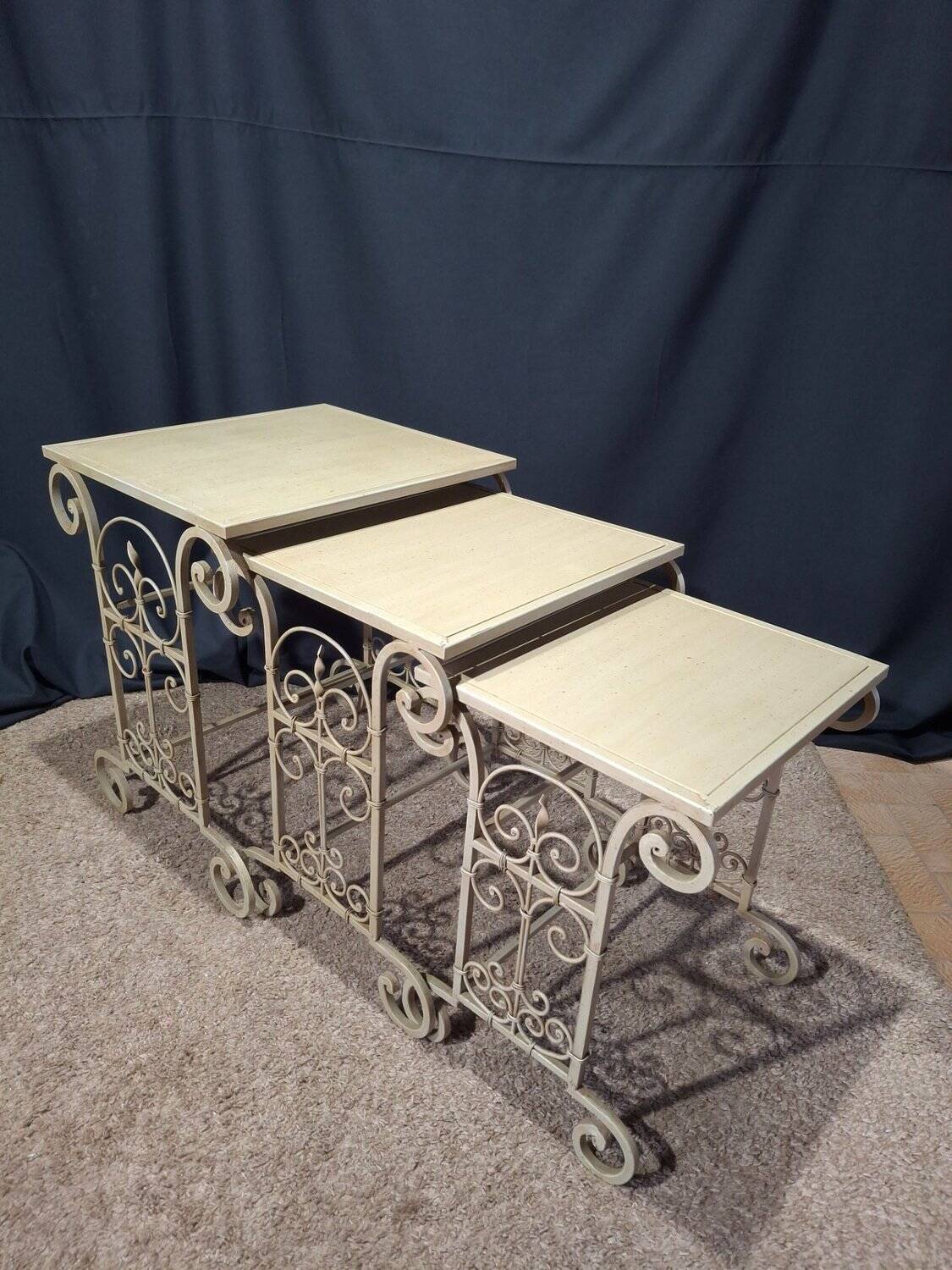 Nesting tables in patinated iron.