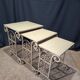Nesting tables in patinated iron.