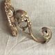 Golden bronze coat hook, 19th century
