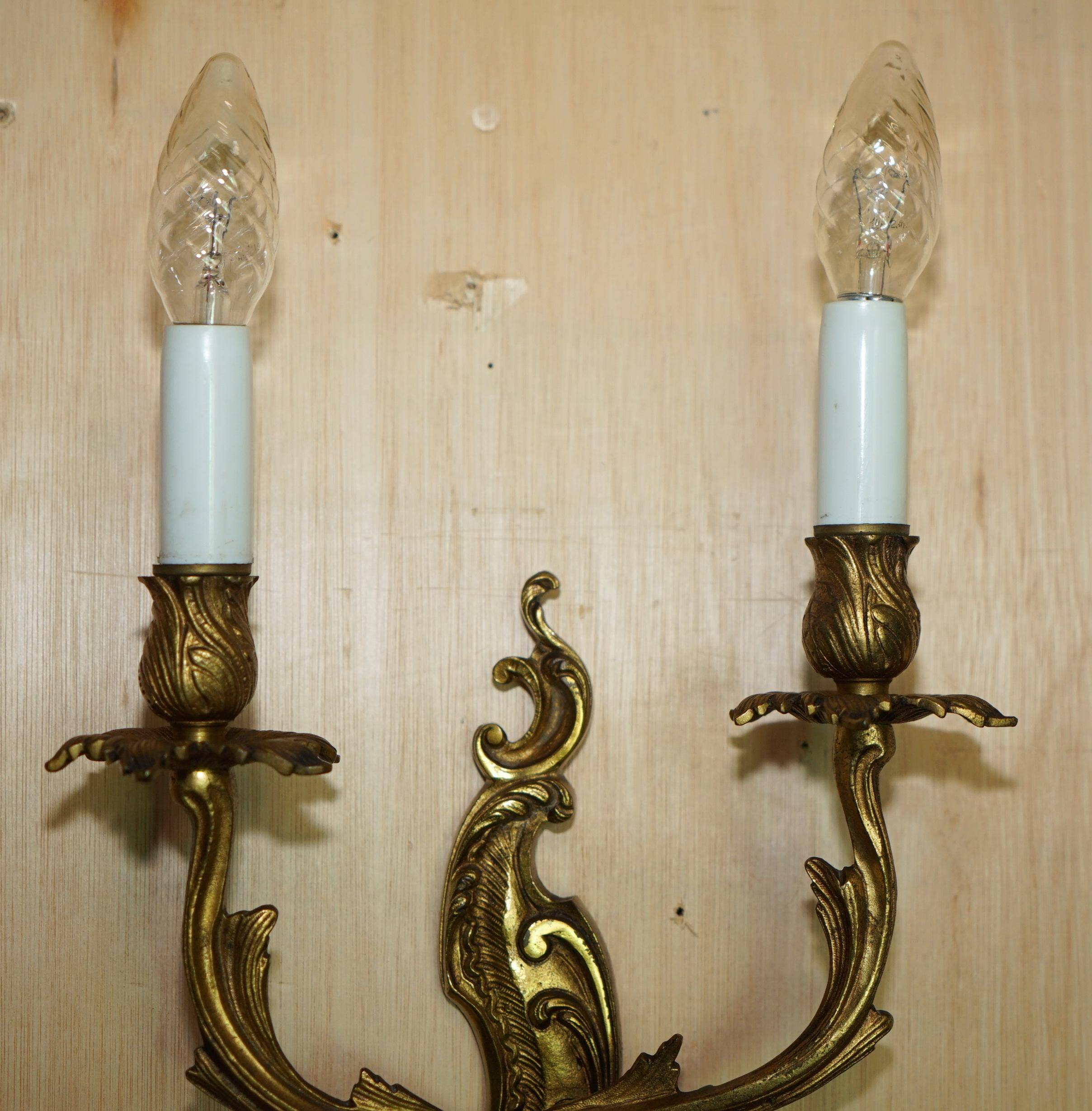Pair of antique French wall sconces, gilded and bronzed, from the 1920s.