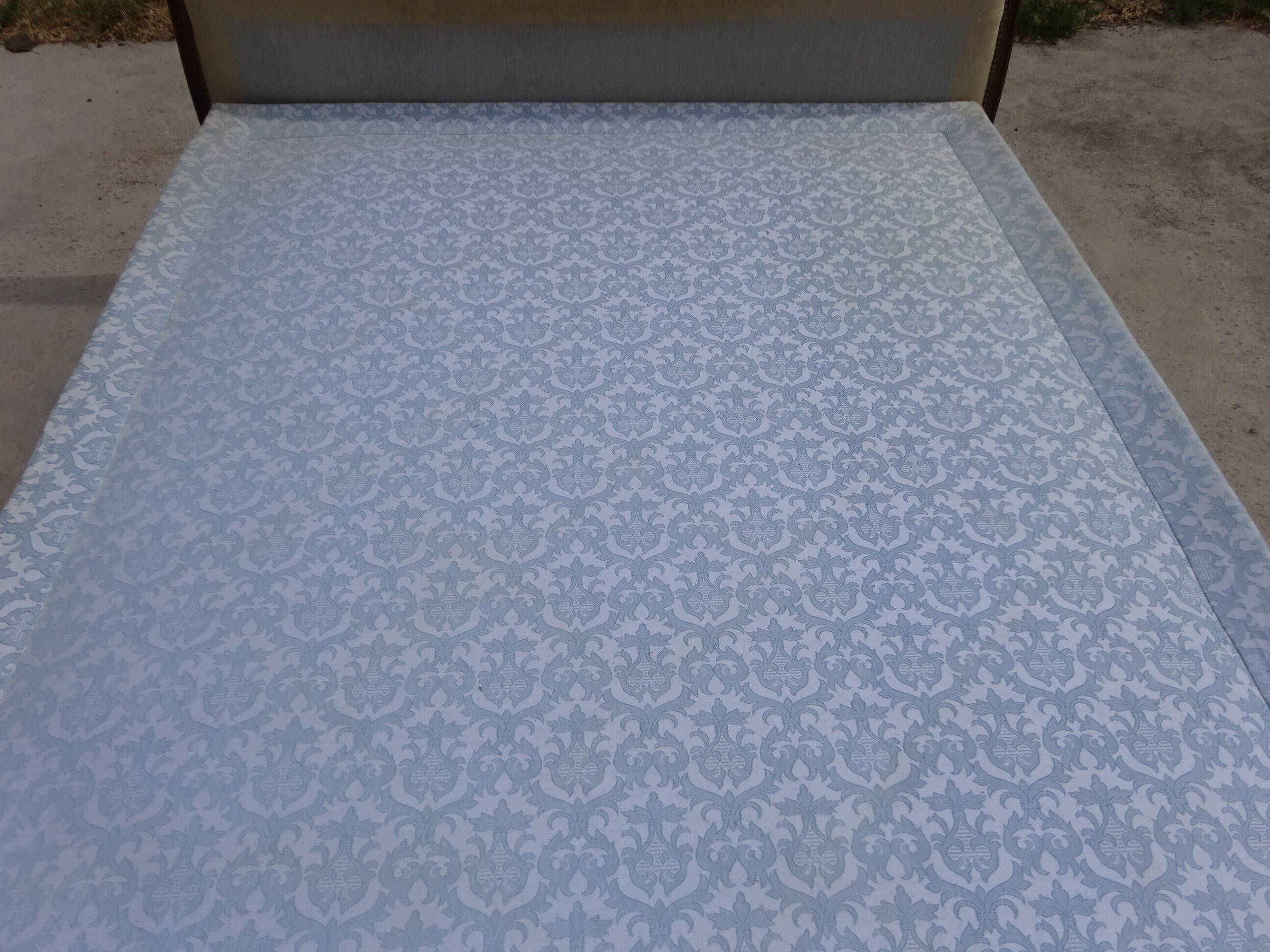 Solid wood bed frame with Jacquard fabric.