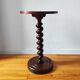 Turned solid wood side table