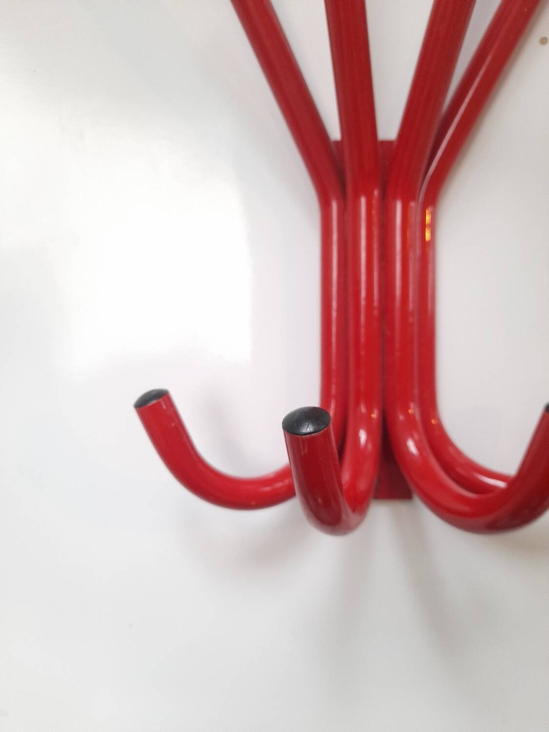 Red lacquered metal coat rack from the 80s